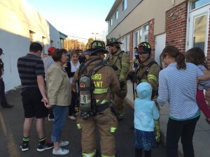 firemen greeting kids